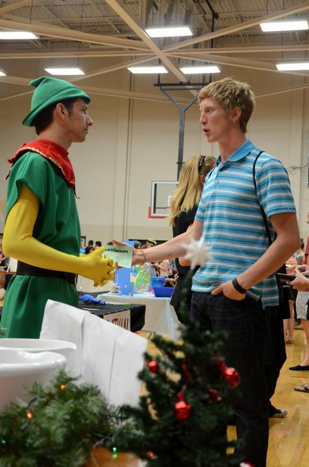 Hunter Hawes, sophomore Christian studies major, talks with freshman Christian Winter during the LifeGroup Fair in Fred DeLay Gymnasium.  - Photo by Anne Richoux