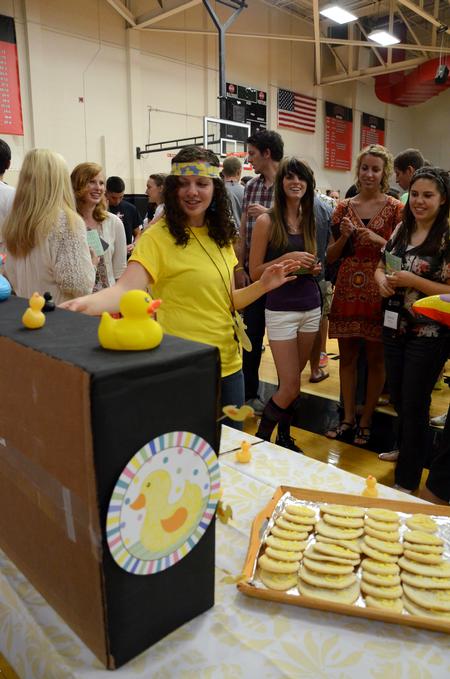 Sarah Moore, sophomore Christian studies major, shows new students her LifeGroup table celebrating 'Rubber Duck Day' during the LifeGroup Fair. - Photo by Anne Richoux