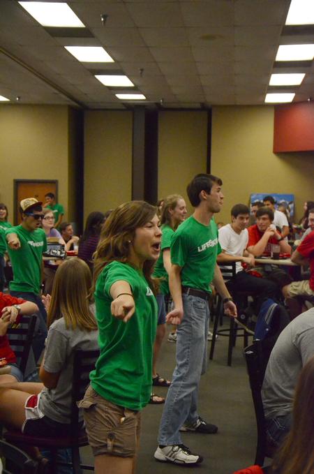 LifeGroup leader Madeleine Hemphill, psychology and business double major, dances during a flashmob in the Brewer Dining Hall in an effort to interest freshmen in joining a LifeGroup. - Photo by Zac Calvert