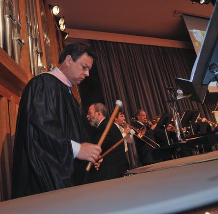 Michael Mann, assistant professor of music, plays the tympani during the Fall Convocation service. - Photo by Morris Abernathy