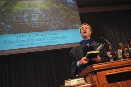 Chris Mathews, associate professor of music and department chair, leads music during Fall Convocation. - Photo by Morris Abernathy