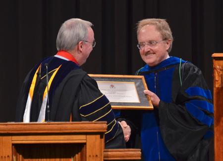 David S. Dockery, president of the university, is joined by Jimmy H. Davis newly installed as the Hammons Chair of Pre-Medical Studies. - Photo by Morris Abernathy