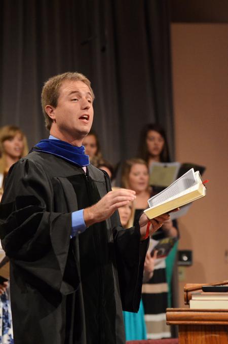 Chris Mathews, associate professor of music and department chair, leads music during Fall Convocation. - Photo by Zac Calvert