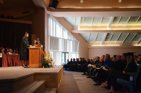 SGA president Kylie McDonald, senior political science major, speaks to students, faculty, and staff during Fall Convocation. - Photo by Zac Calvert