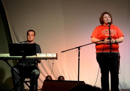 Caylee Dugger, freshman music performance major, accompanied on the keyboard by Greg Hines, senior music performance major, sings the award winning "Popular" from Wicked, grabbing the audience's attention during Focus week Open Mic Night.  - Photo by Ebbie Davis