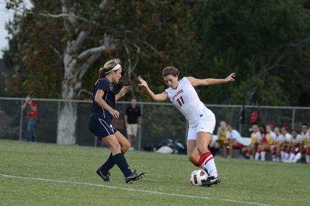 Lady Bulldog Stefanie King maneuvers around Melissa Turney of Missouri Baptist University during a home soccer game. - Photo by Jacob Moore