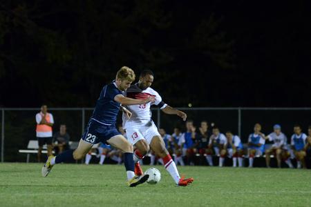 Bulldog team captain Diego Santos tries to gain control of the ball against Missouri Baptist's Tyler Kuehner during a home soccer game. - Photo by Jacob Moore