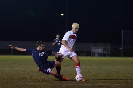 Bulldog Guilherme Reis keeps the ball from a Missouri Baptist player during a home soccer game. - Photo by Jacob Moore