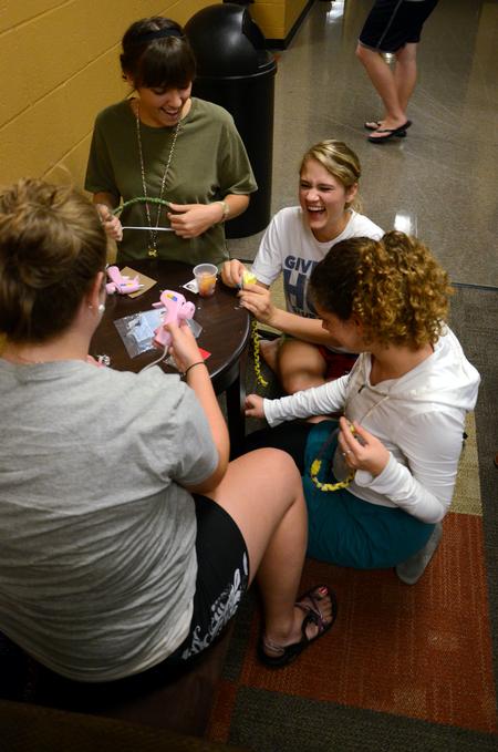 Chesea Coudriet and Morgan Kroeger chat and laugh with Taylor Brown and Rebecca Leon during residence life's Ladies Night in the Bowld Student Commons.   - Photo by Anne Richoux