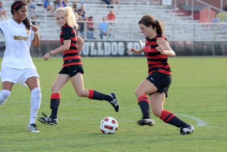 Lady Bulldogs Kelsey Gilbert and Stephie King go up against Belhaven's defense in a home game. - Photo by Ebbie Davis