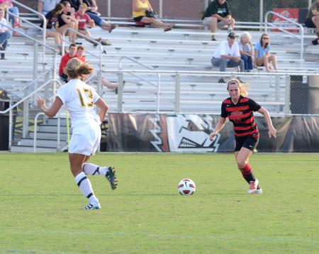 Emily Crane, looks up the field for a pass, while Belhaven's defender meets her. The lady bulldogs came out strong to defeat Belhaven University with a score of 1-0. - Photo by Ebbie Davis