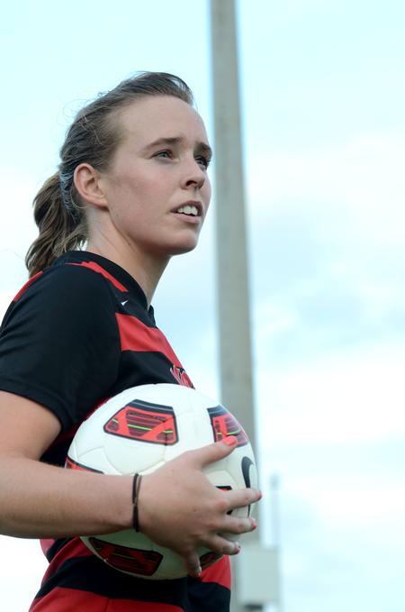 Sara McHenry glances over the field prior to passing the ball in to a teammate in a game against Belhaven University. - Photo by Ebbie Davis