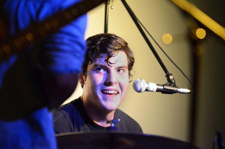 Elliott White, drummer for the band Yung Life, smiles during an energetic performance in Barefoots Joe. - Photo by Zac Calvert