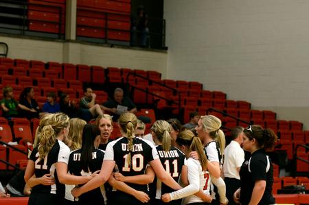 The Lady Bulldog volleyball team huddles during a game against the University of West Florida. - Photo by Anne Richoux