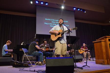 Ben Williams and other members of Christ Community Church lead music during chapel. - Photo by Zac Calvert