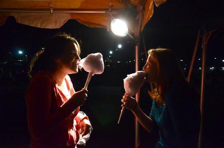 Rachel Robbins, junior music major, and Alexis Piscatello, freshman music major, enjoy cotton candy at Union Night during Family Weekend. - Photo by Jacob Moore