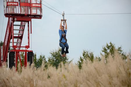 Molly Priddy, senior sociology major, enjoys the zip line at Union Night during Family Weekend.  - Photo by Anne Richoux