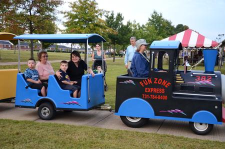 Families enjoy the train ride around the Great Lawn at Union Night during Family Weekend. - Photo by Anne Richoux
