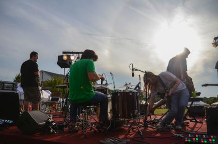 Zach Foropoulos, Taylor Hare, Austin Gray and Chris Hare prepare to play live music on the Great Lawn during Union Night, a Family Weekend event. - Photo by Zac Calvert