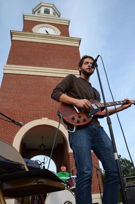 Rob Griffith, junior English major, practices a song before Union Night, a Family Weekend event, in front of Miller Tower. - Photo by Zac Calvert