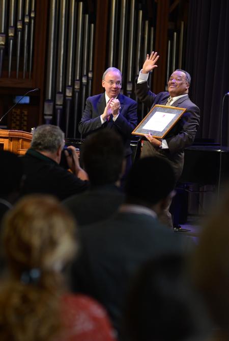 Fred Luter, president of the Southern Baptist Convention, thanks the audience after speaking in chapel. David S. Dockery, president of the university, presented a certificate to Luther celebrating his induction into the R. G. Lee Society of Fellows. - Photo by Jacob Moore