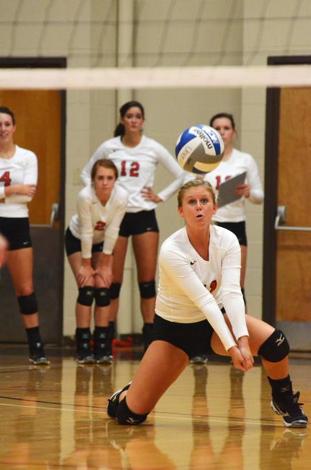 Lauren Sprouse, senior psychology major, goes down to dig the ball during a match against University of Alabama-Huntsville. - Photo by Zac Calvert
