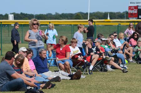 Family and parents line the fields at West Jackson Baptist Church as students play intramural football during Family Weekend. - Photo by Zac Calvert