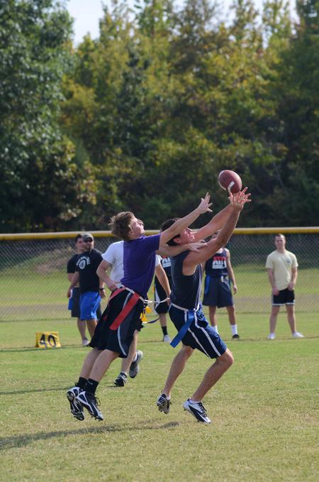 Noah Hunt, sophomore physical education major, and Jesse Dahms, freshman undecided major, battle for the football at an intramural game during Family Weekend. - Photo by Zac Calvert