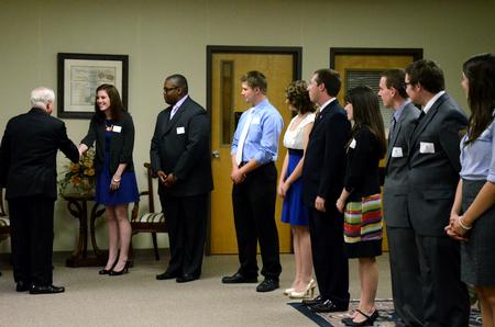 Former Secretary of Defense Robert M. Gates talks with Student Government Association president Kylie McDonald, senior political science major, and other student leaders during a reception before the 15th Annual Scholarship Banquet.  - Photo by Anne Richoux