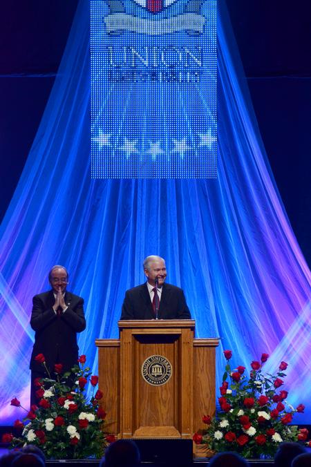 Robert M. Gates, former U.S. secretary of defense, cracks up while talking about his love-hate relationship with Texas A&M's football team while answering questions at the 15th Annual Scholarship Banquet.  - Photo by Ebbie Davis