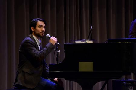 Cody Curtis, assistant residence director, talks to students about a song while leading worship music during the final chapel of Faith in Practice week.  - Photo by Anne Richoux