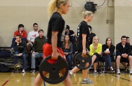 Students watch competitors in the Union's Most Fit contest compete in the farmer's walk. - Photo by Jacob Moore