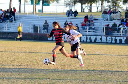 Sara Johnson dribbles past a Cumberland University player during the last home soccer game of the Lady Bulldog soccer team's season.  - Photo by Anne Richoux
