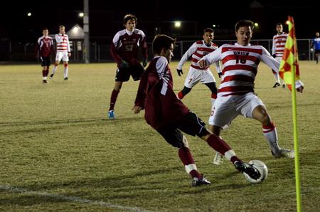 Cody Styx battles for possession of the ball against a Cumberland University player during the last home soccer game of the season.  - Photo by Anne Richoux