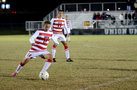 Guilherme Celli dribbles down field during the Bulldogs' last home soccer game of the season.  - Photo by Anne Richoux