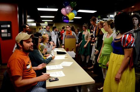 Brooks Brasfield, junior social work major, talks with students while judging costumes during Costume Coffee House, an annual event hosted by Residence Life.  - Photo by Anne Richoux