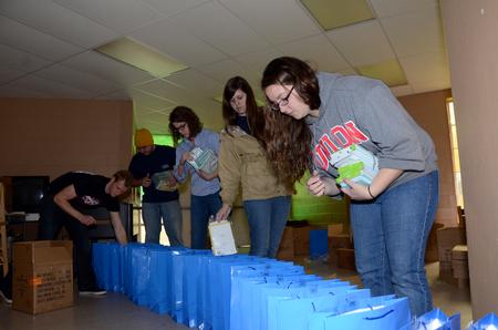 (Front to back) Joy Atkinson, Courtney Searcy, Elizabeth Tomyn, Paul Day, and Matt Moore volunteer at The Salvation Army as a part of the  tenth annual Campus and Community Day.  - Photo by Anne Richoux