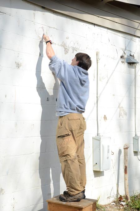 Georg Pingen, assistant professor of engineering, volunteers at the East Chester site of Mission Jackson, an outreach program of Englewood Baptist Church, during Campus and Community Day.  - Photo by Anne Richoux