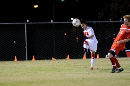 Leo Santin sends the ball toward the goal during a game against Tennessee Temple University for the semifinal round of the NCCAA mideast region tournament. - Photo by Anne Richoux