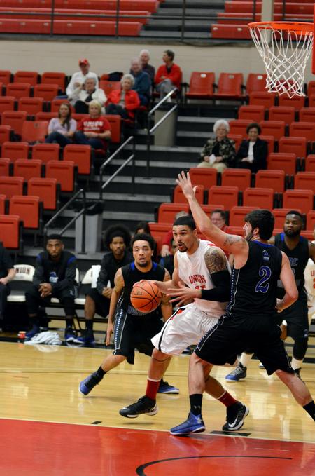 Anthony Freeman dribbles around Central Baptist players during the Bulldogs season opener, which Union won 86-70.  - Photo by Anne Richoux