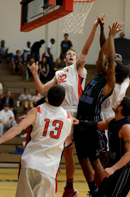 Eric Leisey fights for the rebound against Central Baptist College players during the season opener, which the Bulldogs won 86-70.  - Photo by Anne Richoux