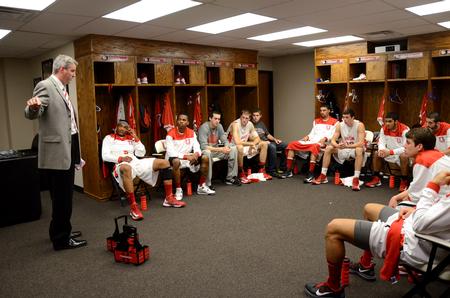 David Niven, head coach, talks with the Bulldog basketball team during half time of their season opener game against Central Baptist College. - Photo by Anne Richoux