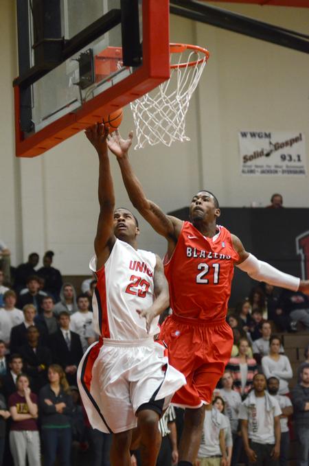 Corieon Pearson goes up for a shot against Valdosa State's Alan Love during Union's first game as a member of the Gulf South Conference. - Photo by Jacob Moore