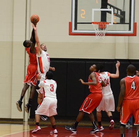 Anthony Freeman, Jr., goes up to block Valdosa State's James Anacreon during Union's first game as a member of the Gulf South Conference. - Photo by Jacob Moore