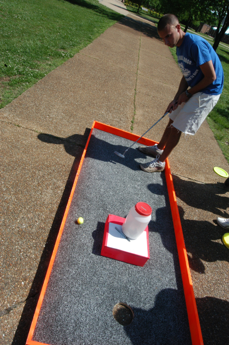 Sophomore Joel Polk putts for a cure in a benefit for St. Judes during Up 'Til Dawn. - Photo by Jonathan Blair
