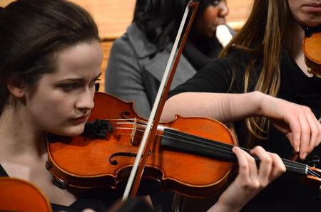 Grace Carbonell, freshman nursing major, contributes to the department of music's production of "Noye's Fludde" at First Baptist Church as a part of the Benjamin Britten centennial celebration. - Photo by Olivia Wallace