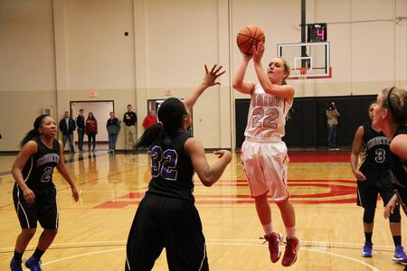 Amy Philamlee shoots over a Lady Hawks defender during the Homecoming game. - Photo by Matt McDaniel