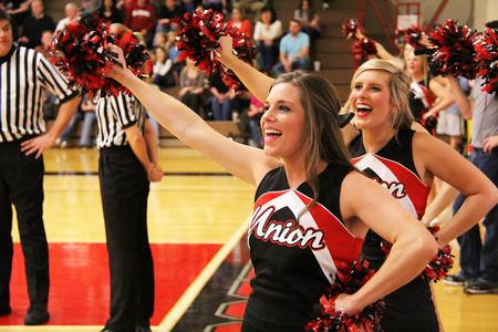 Karlie Roser and Kayla Dubrule cheer on the Lady Bulldogs in the Homecoming game against Shorter University. - Photo by Matt McDaniel