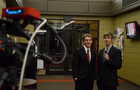 Zac McMillan, junior intercultural studies major, finishes a report from the red carpet at the Student Film Festival with co-host James Watlington, sophomore media communications major. - Photo by Jacob Moore