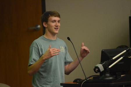 Stephen Hauss, senior business administration major, speaks at the Senate meeting about the different kinds of leadership.
 - Photo by Matt McDaniel